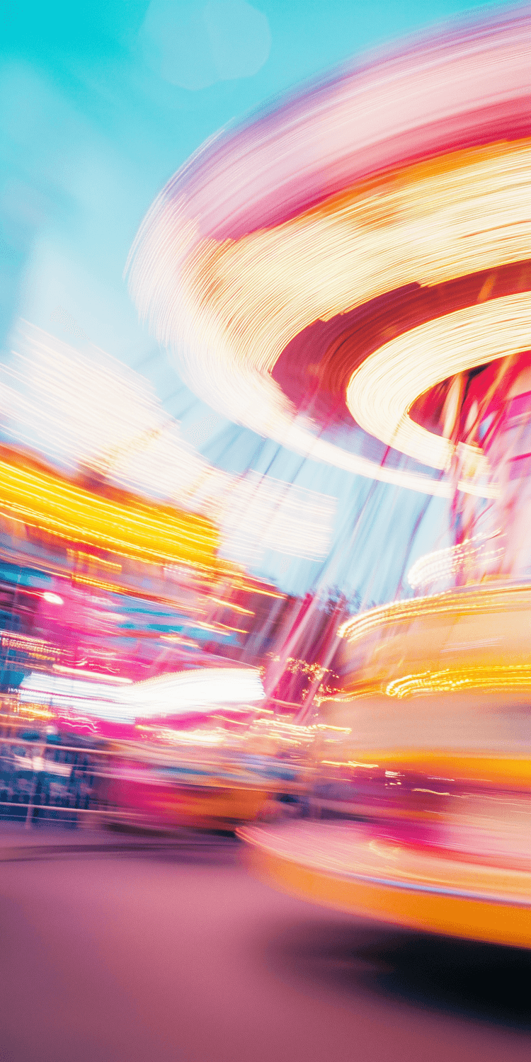 A colourful ride turning against a soft blue evening sky